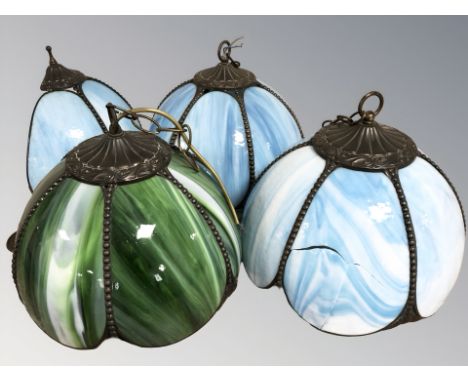 Three Tiffany-style coloured glass light shades and a further similar wall light. (1 cracked)