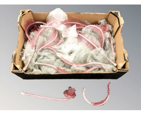 A quantity of cranberry glass epergne branches. (1 box)