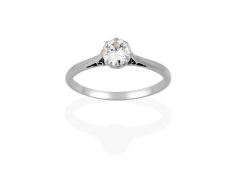 the round brilliant cut diamond in a white claw setting, to a tapered shoulder plain polished shank, estimated diamond weight