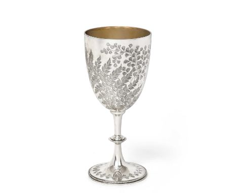 the bowl tapering and engraved with foliage, on spreading beaded base similarly engraved and with knopped stem23cm high, 8oz 