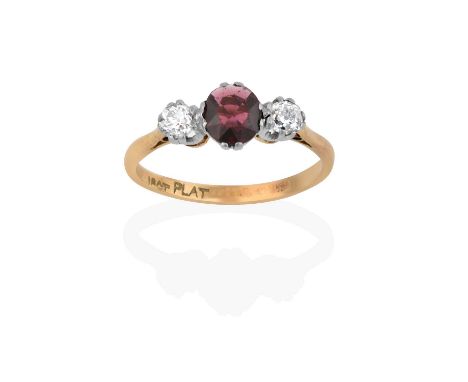 the round cut ruby flanked by old cut diamonds, in white claw settings, to a yellow tapered shoulder plain polished shank, to