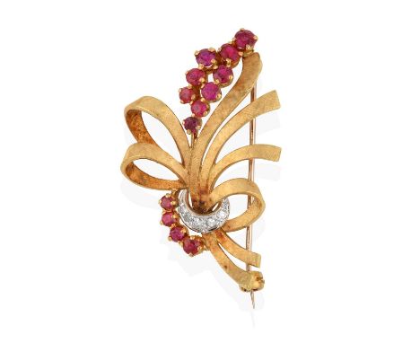 textured yellow ribbons with round cut ruby sprays in yellow claw settings, gathered by eight-cut diamonds in white claw and 