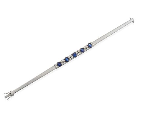 five graduated oval cut sapphires flanked by pairs of round brilliant cut diamonds, in claw settings, to a tapered brick link