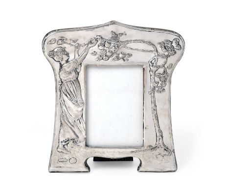 shaped oblong, the sides stamped with a lady picking fruit, with wood easel-back22.6cm wide by 25cm highCondition report: Mar