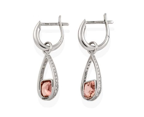 a plain polished hoop suspends an eight-cut diamond set pear-shaped hoop, with a cushion cut pink tourmaline centrally, in cl