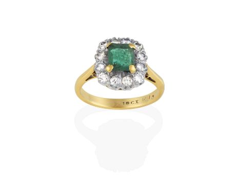 the emerald-cut emerald in a yellow claw setting, within a border of round brilliant cut diamonds in white claw settings, to 