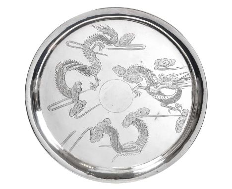 circular and on four compressed ball feet, engraved with dragons and a central vacant cartouche24cm diameter, 14oz 3dwt, 439g