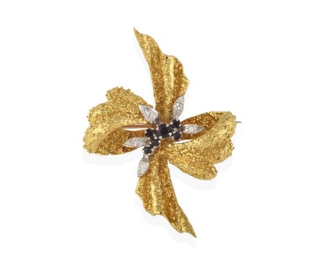 modelled as a stylised bow motif, the yellow textured ribbon gathered centrally by round cut sapphires and round brilliant cu