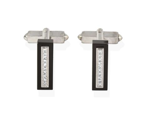 the rectangular onyx plaque with a row of eight-cut diamonds centrally, in white claw settings, total estimated diamond weigh
