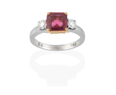 the octagonal step cut rubellite, in yellow claw settings, flanked by round brilliant cut diamonds, in white claw settings, t