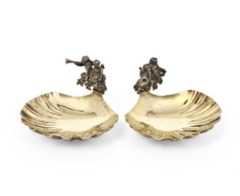 to commemorate the birth and christening of Prince William, each with shell-shaped bowl, the finial cast as two putto, one ho
