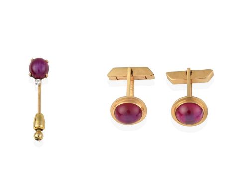 the cufflinks composed of an oval cabochon synthetic star ruby within a yellow rubbed over setting, with swivel bars; the sti