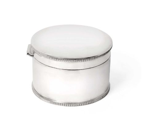 cylindrical and with gadrooned borders and hinged cover, engraved inside the cover with an inscription13.5cm diameter, 18oz, 