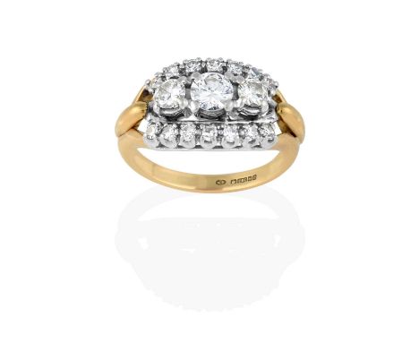 three graduated round brilliant cut diamonds flanked by rows of eight-cut diamonds, in white claw settings, to a yellow forke