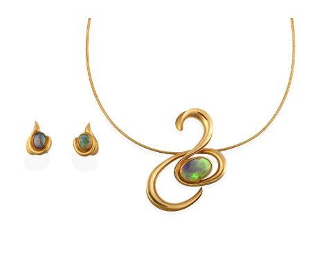 the oval black opal in a yellow rubbed over setting, within a yellow swirl motif, on a snake link chain; the earrings of simi