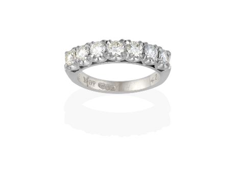 the round brilliant cut diamonds in white claw settings, to a forked shoulder plain polished shank, total estimated diamond w