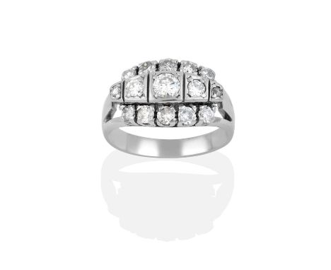 the central five graduated round brilliant cut diamonds in white square settings, flanked by round brilliant cut diamonds in 