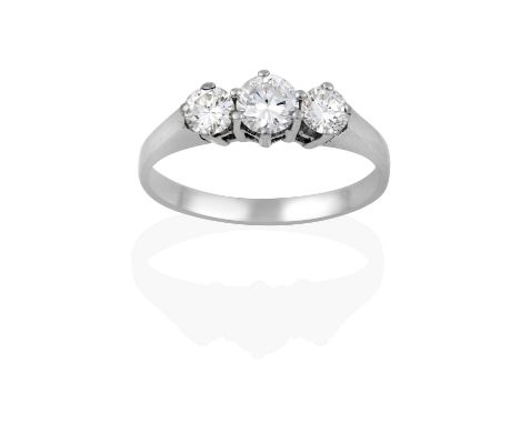 the graduated round brilliant cut diamonds, in white claw settings, to a tapered shoulder plain polished shank, total estimat