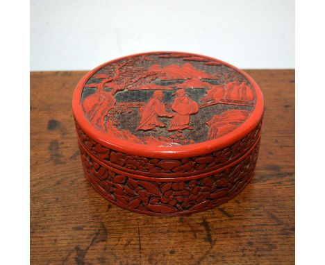 Cinnabar lacquer bowl and coverChinese, 18th/19th Centurywith two scholars conversing on a terrace with pine trees and mounta