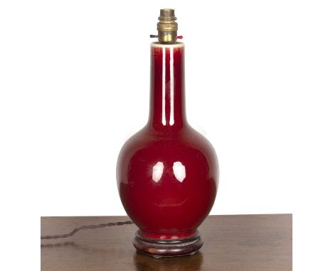 Sang de boeuf bottle vaseChinese, 18th/19th Centuryconverted to a table lamp, and with a hardwood base, 35cm high  Drilled an