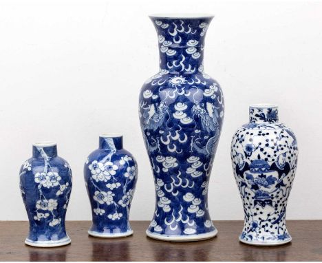 Group of four vasesChinese, 19th Centurycomprising: a near pair of of blue and white cherry blossom vases, each with four cha