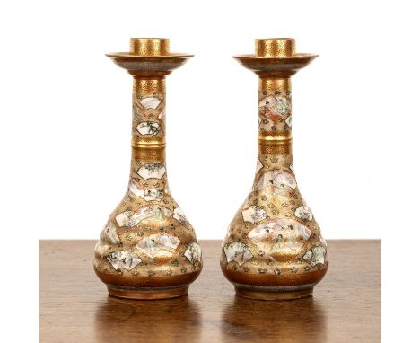 Pair of small Kutani candleholdersJapaneseeach painted with fans designs, signed, 18cm high (2)  Chip to underside of the bas