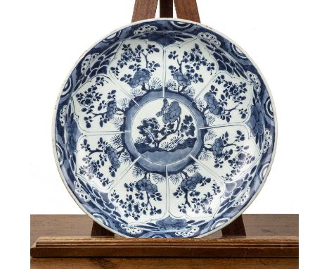Blue and white large shallow dish/chargerChinese, Kangxi period (1662-1722)painted with panels of flowers, with a sacred fung