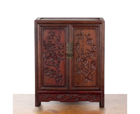 Hardwood table cabinetChinesethe carved panel doors enclosing small drawers, 31.5cm wide x 17cm deep x 40cm high  With some s