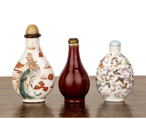 Three porcelain snuff bottlesChinese, 1820-1920including a white porcelain bottle, 1850-1920, decorated in copper red with a 