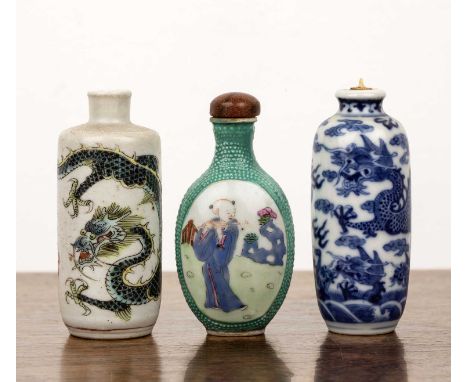 Three porcelain snuff bottlesChineseto include a porcelain snuff bottle,Daoguang period (1821-1850), of ovate cylindrical for