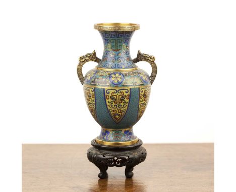 Cloisonné vaseChinese, 19th Centuryof turquoise ground with panels of taotie designs, roundels of foliate designs, and mythic