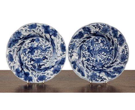 Pair of blue and white shallow bowlsChinese, Kangxi period (1662-1722)painted with phoenixes and flowers, within lobed border