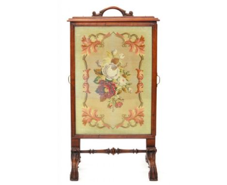 A VICTORIAN MAHOGANY CHEVAL FIRESCREEN WITH BERLIN WOOLWORK FLORAL PANEL, CARVED HANDLE AND LEGS, 105 X 62CM