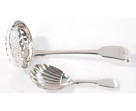 A GEORGE III SILVER SUGAR SIFTER, FIDDLE PATTERN, CRESTED, LONDON 1816 AND A VICTORIAN SILVER CADDY SPOON, FIDDLE PATTERN, 2O