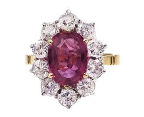 18ct gold oval pink sapphire and round brilliant cut diamond cluster ring, London import mark 1989, sapphire approx 1.70 cara