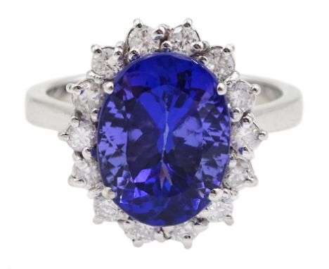 18ct white gold oval tanzanite and round brilliant cut diamond cluster ring, stamped 750, tanzanite approx 4.20 carat, total 