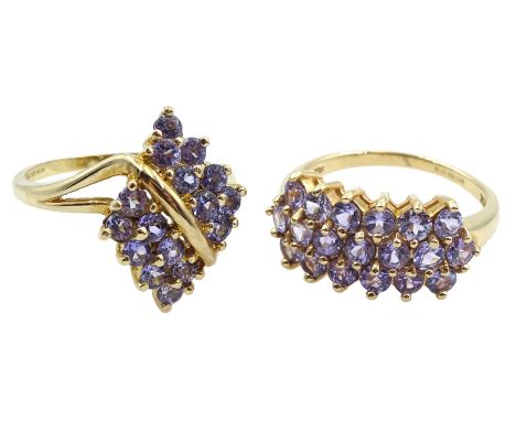 Gold tanzanite marquise shaped cross over ring and a gold three row tanzanite ring, both hallmarked 9ct Condition Report:Appr