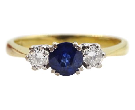 18ct gold three stone round sapphire and diamond ring, London 1988, total diamond weight approx 0.30 caratCondition Report:Ap