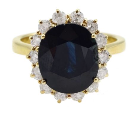 18ct gold oval sapphire and round brilliant cut diamond cluster ring, hallmarked, sapphire approx 4.85 carat, total diamond w