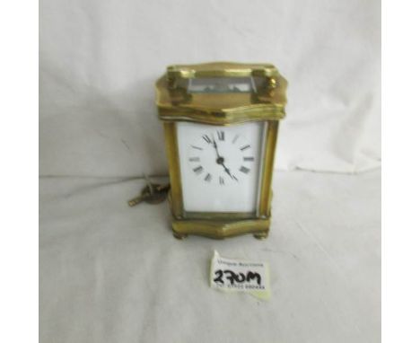 An old brass carriage clock complete with key and in working order.