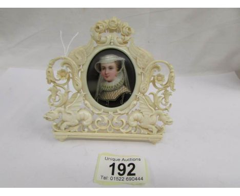 A 19th century miniature portrait of a lady in an ornate ivory frame (frame a/f), ****Condition report**** No chips, cracks o