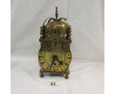 An early 20th century brass lantern clock, in working order. ****Condition report**** Spring ok but needs cleaning