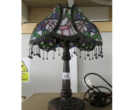 A table lamp with Tiffany style shade.