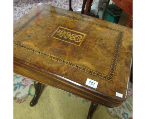 A mid-Victorian walnut sewing table with inlaid fold-over games compendium table-top for chess, backgammon and cribbage