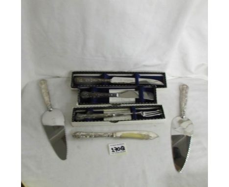 2 silver handled cake slices, 3 silver handled knives and a silver handled pickle fork.
