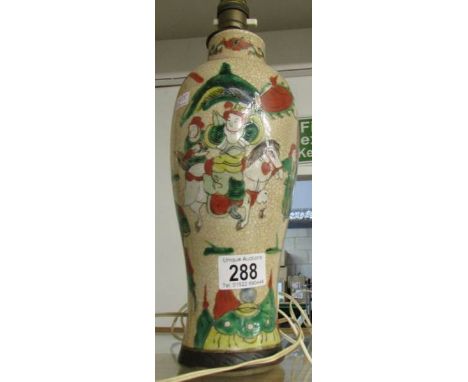 A Chinese crackle glaze vase converted to a table lamp with character marks.