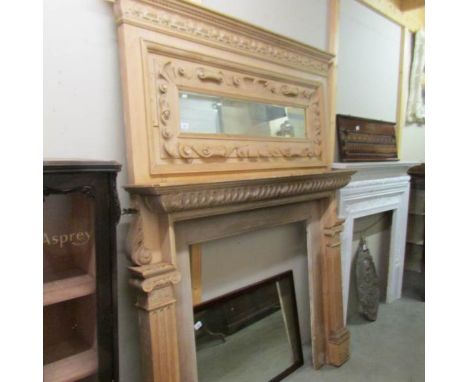 A large Victorian fire surround with over mantel mirror. ****Condition report**** This is pine.One piece.Has age related join