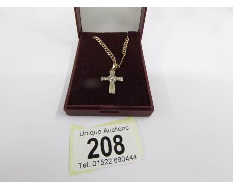 A diamond set cross with attached chain in 9ct gold (rose gold) 8.2 grams.