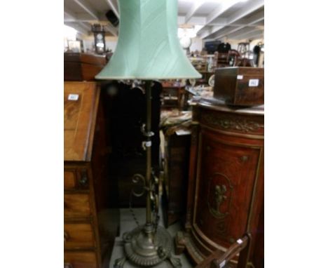 An Art Nouveau silver plate on brass standard lamp.