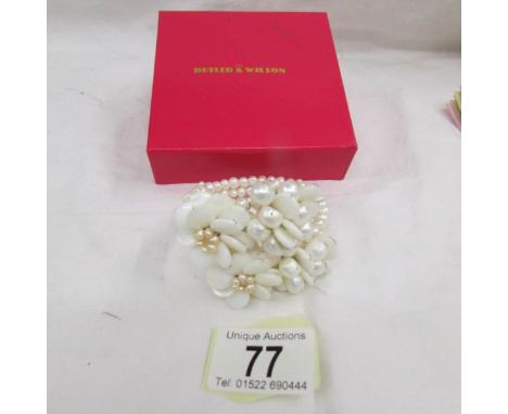 A Butler and Wilson cultured pearl bracelet in original box.